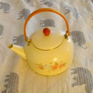 Vintage teapot with floral print